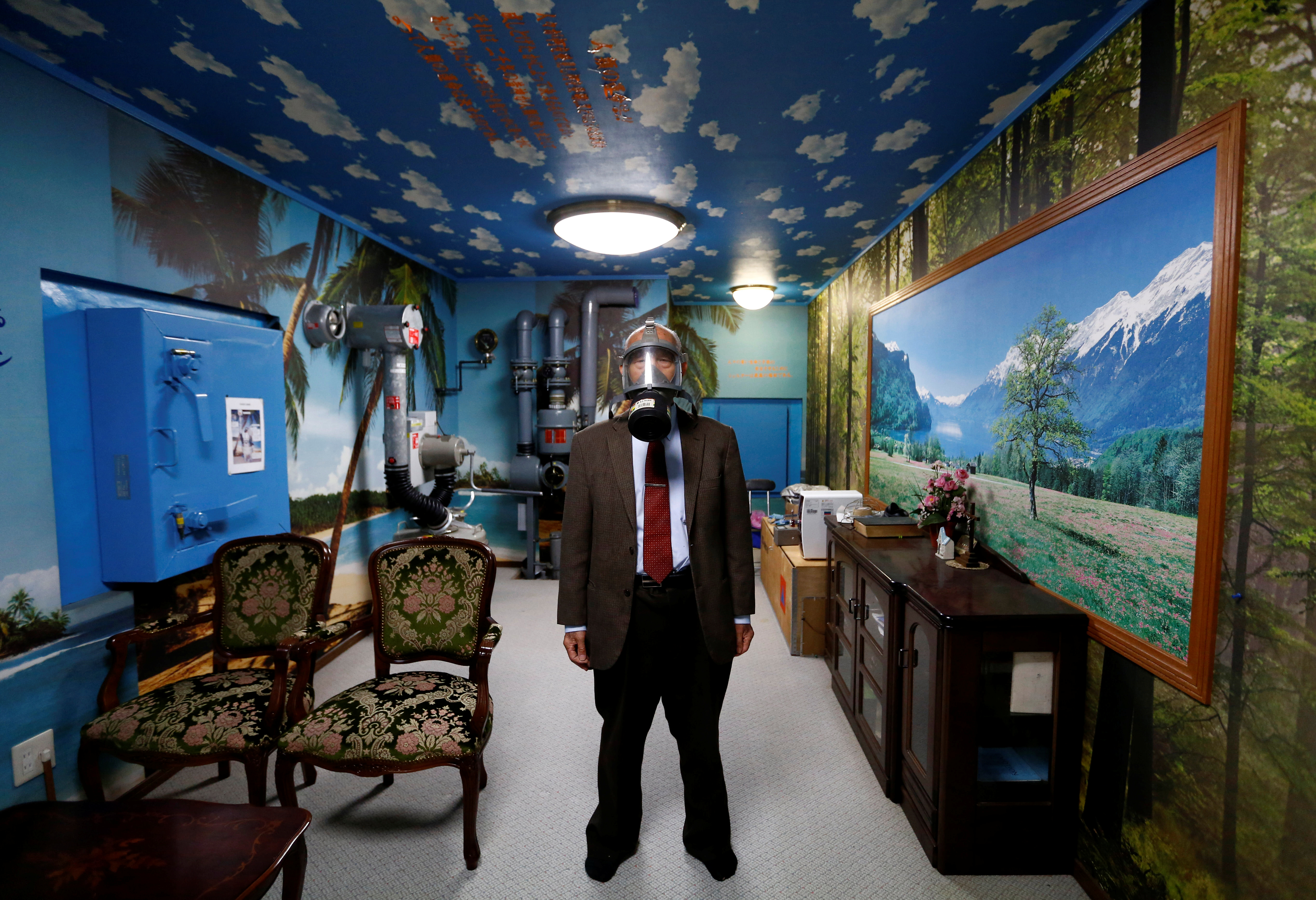 Seiichiro Nishimoto, CEO of Shelter Co., poses in his company-built nuclear shelter in his basement in Osaka, Japan.