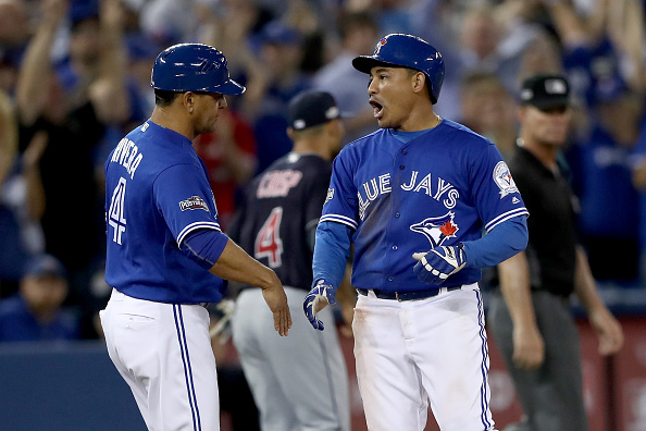 Ezequiel Carrera #3 of the Toronto Blue Jays celebrates after hitting a triple to right field against the Cleveland Indians during game four of the American League Championship Series.