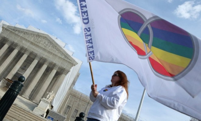 Same-sex marriage proponent Kat McGuckin of Oaklyn, N.J., stands in front of the Supreme Court on Nov. 30. 