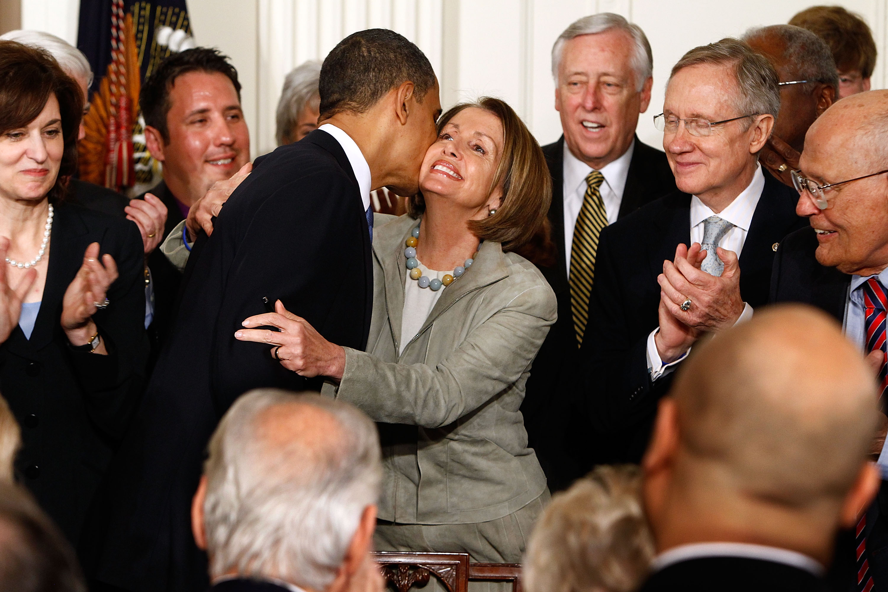 President Obama kisses House Speaker Nancy Pelosi after signing the Affordable Health Care for America Act on March 23, 2010.