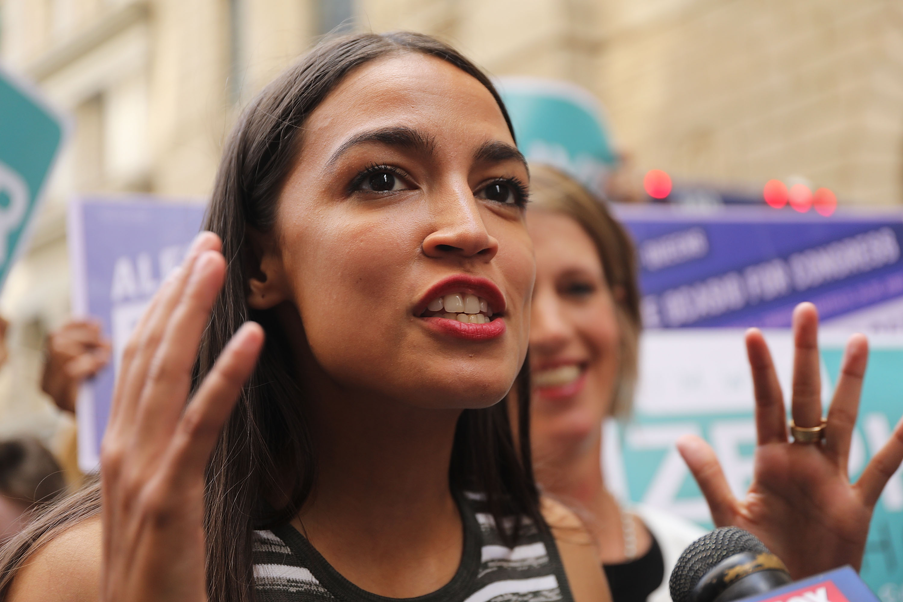 Alexandria Ocasio-Cortez marches in New York as a Democratic socialist and rising liberal star