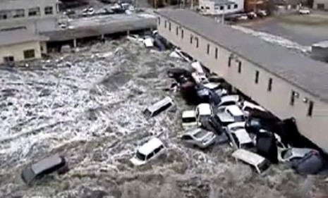Cars collect at the side of a building as tsunami waves ravage Japan&#039;s Kesennuma port earlier this month.