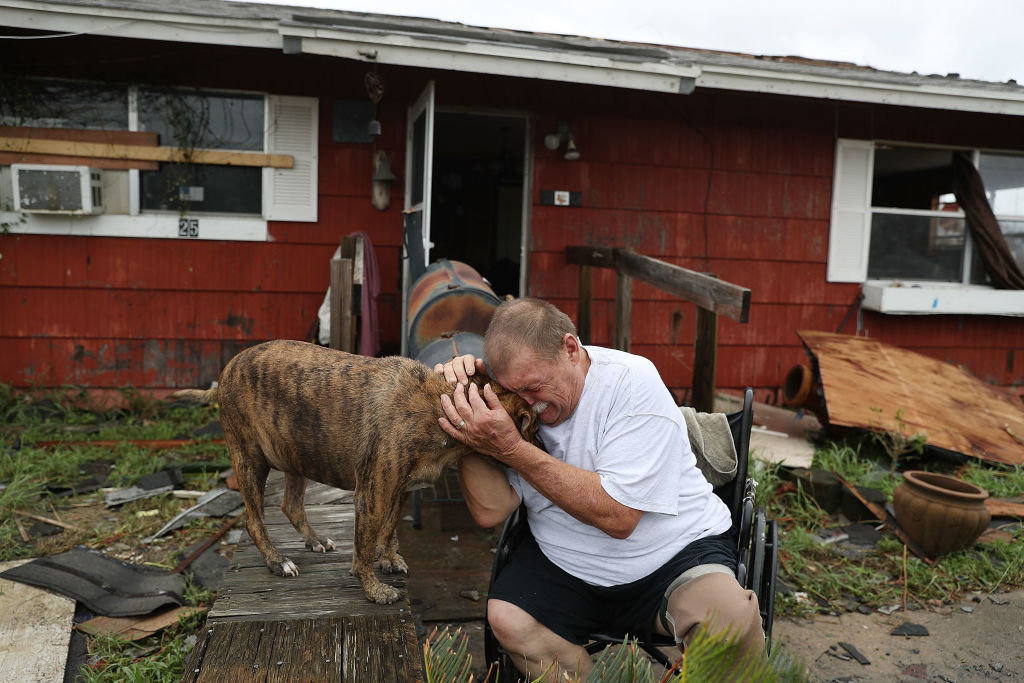 Steve Culver cries with his dog Otis as he talks about what he said was the, &#039;most terrifying event in his life,&#039; when Hurricane Harvey blew in and destroyed most of his home while he and his
