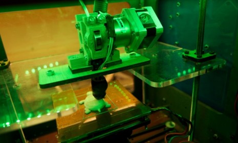 3D printers creates objets, usually out of plastic, layer-by-layer from digital files; this 3D printer is in the midst of printing a turtle.