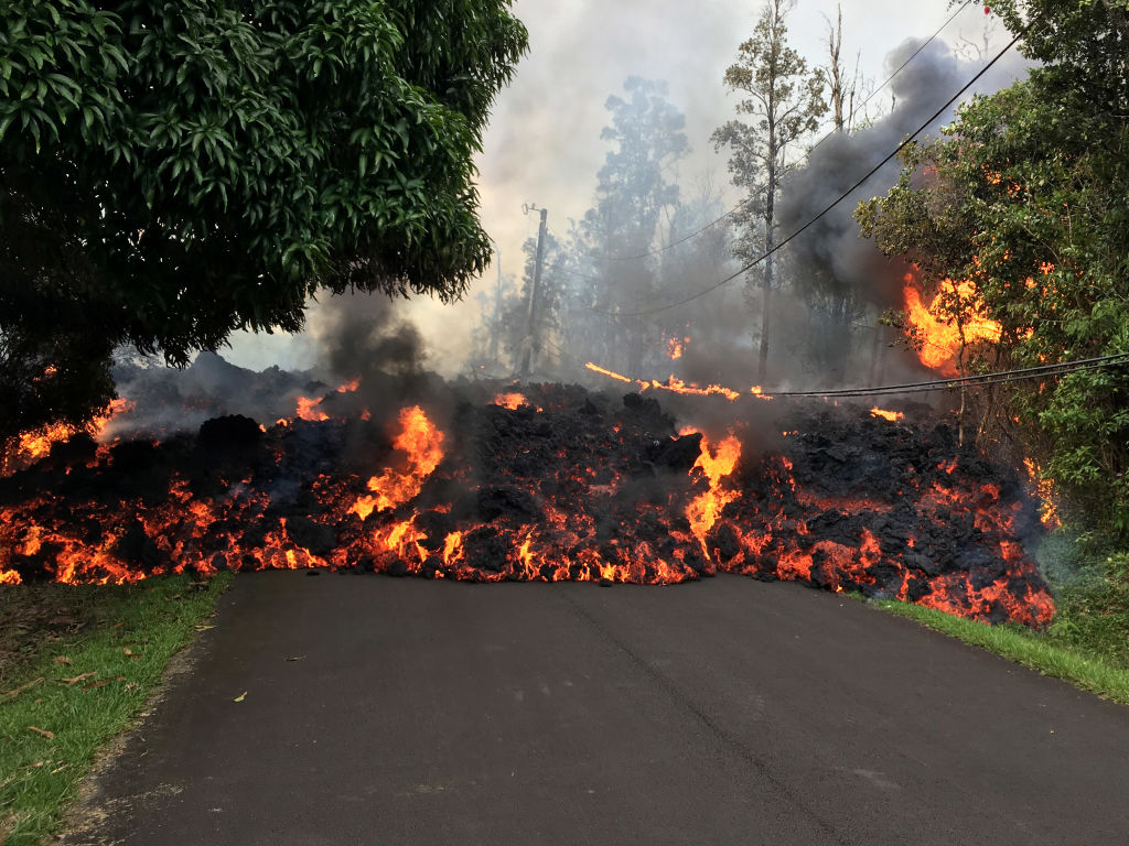 Lava flows across a road in Hawaii