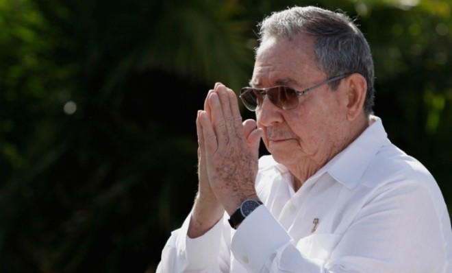 Cuban President Raul Castro gestures goodbye to reporters after a press conference on Feb. 22.