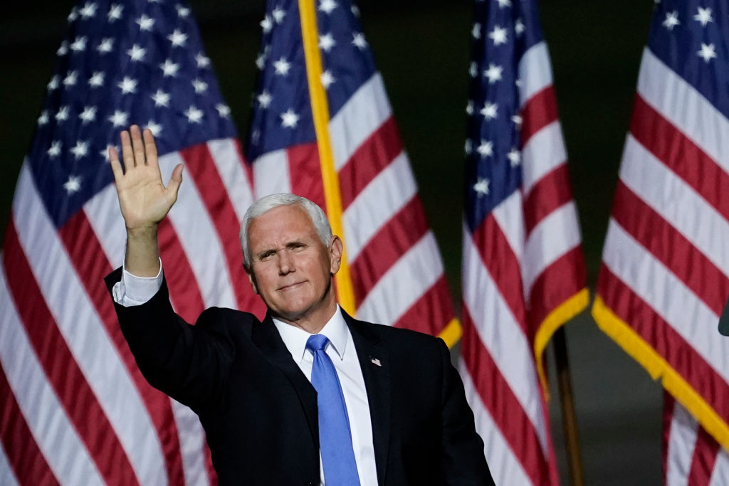 Vice President Mike Pence waves after speaking during a campaign rally at Newport News/Williamsburg International Airport on September 25, 2020 in Newport News, Virginia.