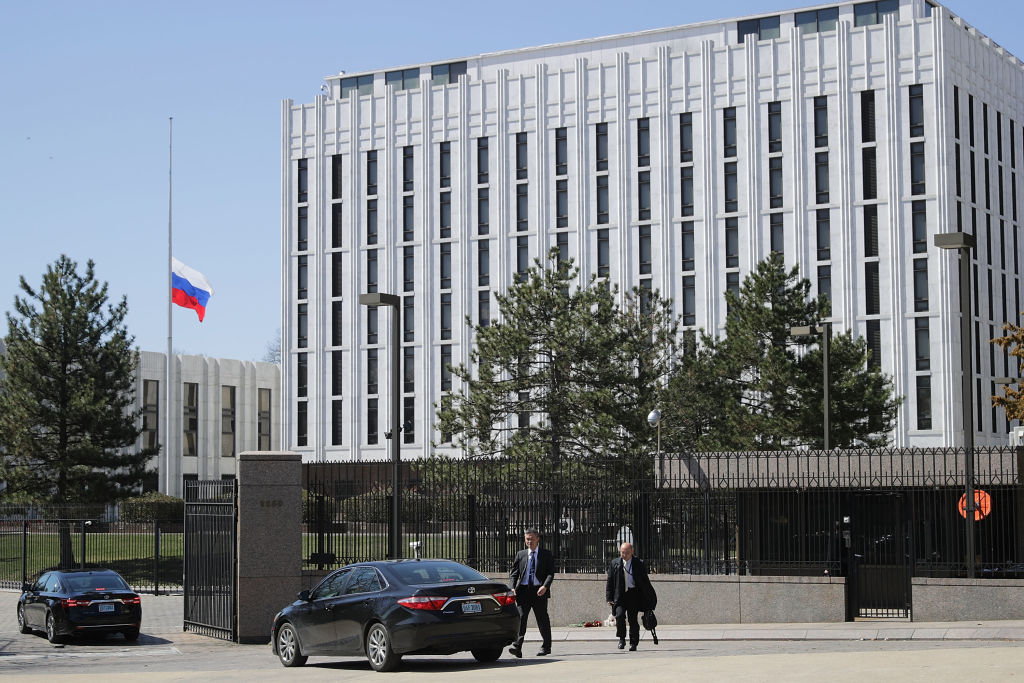 People wait to enter the Embassy of the Russian Federation in Washington, D.C.
