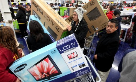 Customers shop for electronics at a Best Buy in San Diego on &quot;Black Friday&quot; last year.