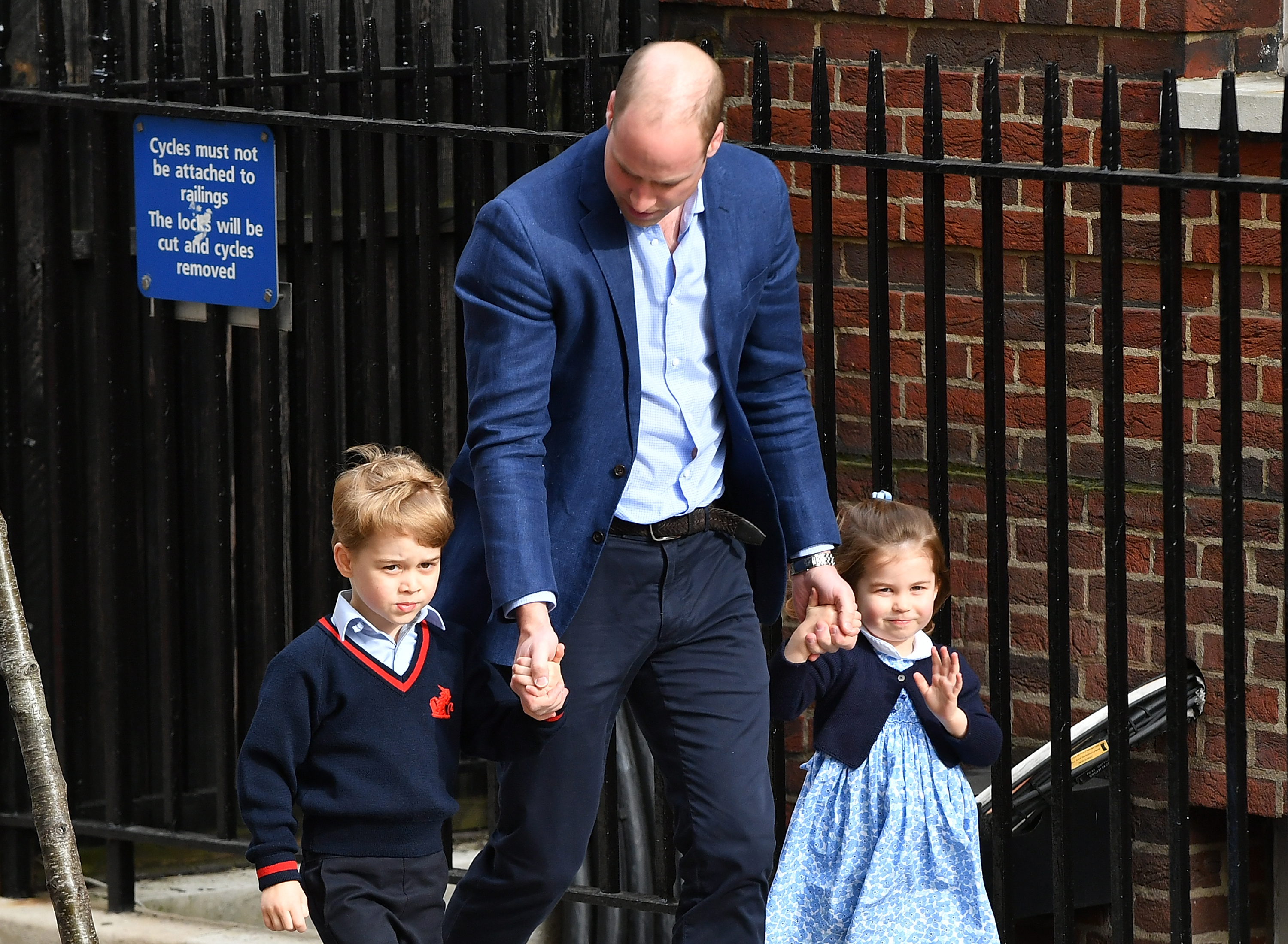 Prince George, his father William, and his sister Charlotte.