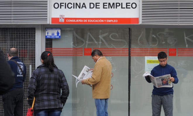 People line up outside a job center in 2011 in Madrid. 