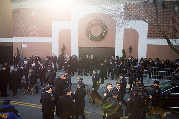 Photos: Thousands turn out to pay their respects at NYPD officer&#039;s funeral