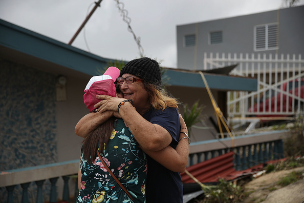 A mother and daughter hug after finding each other following Hurricane Maria.
