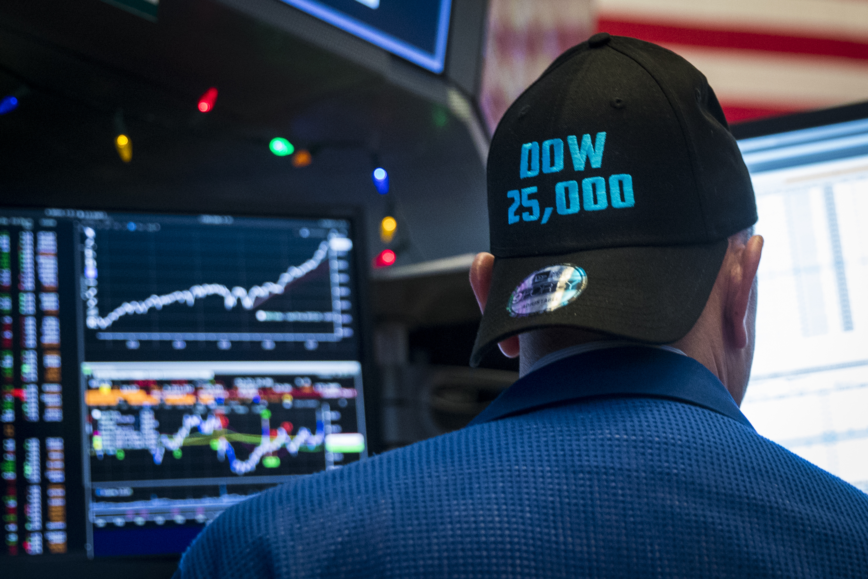 A trader wears a hat to celebrate the Dow&#039;s new record