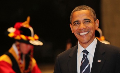 Obama is all smiles as he enters National Museum of Korea in Seoul for G20 summit kick-off dinner.