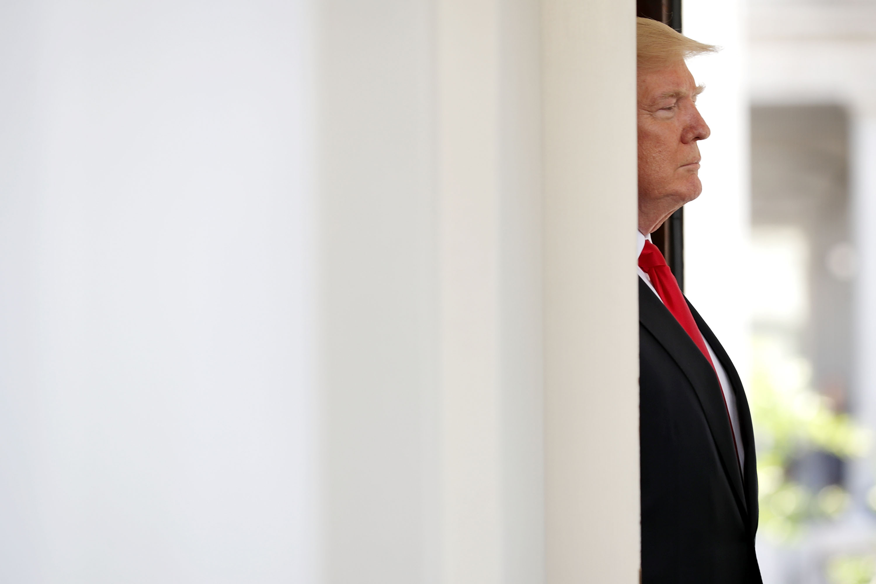President Trump waits outside the White house