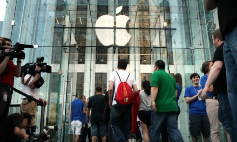 People wait in line for the iPhone 4 in New York City in 2010
