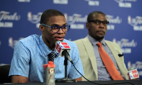 Flaunting a curiously cool bespectacled style, Oklahoma City Thunder all-stars Russell Westbrook and Kevin Durant speak to the press Thursday.