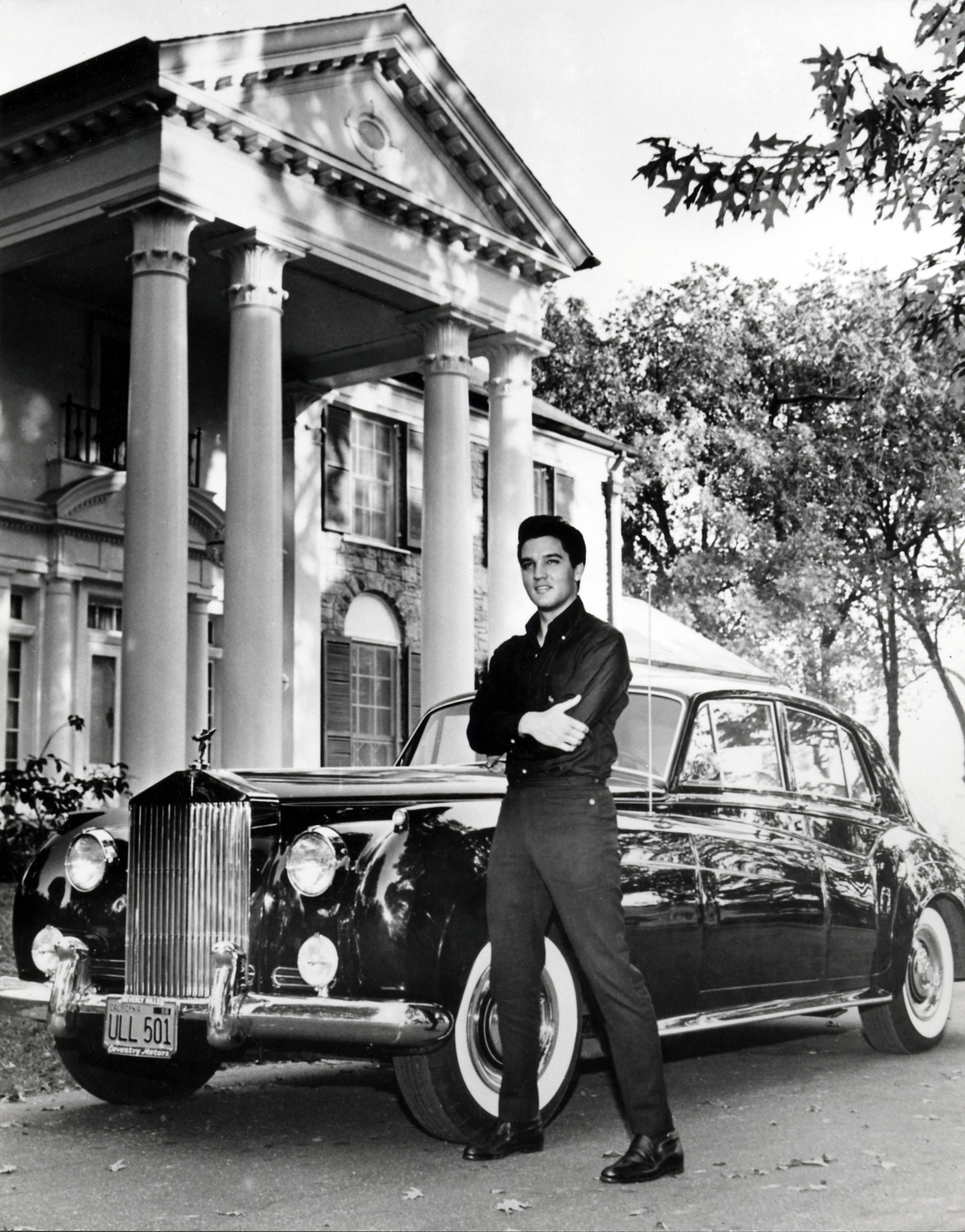 Elvis outside of his Graceland home.