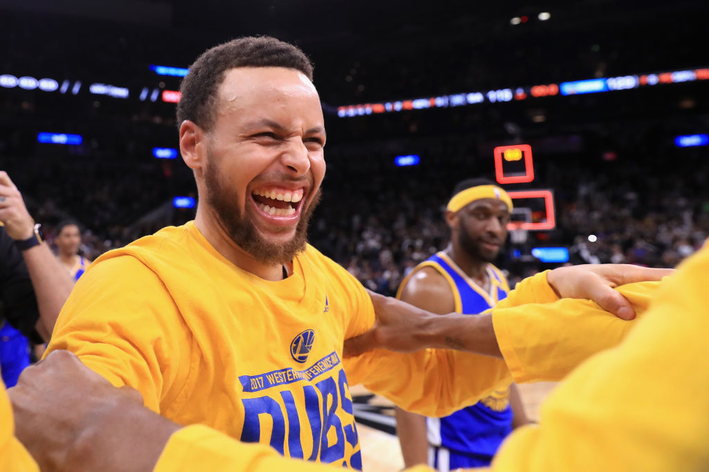 Steph Curry celebrates the Golden State Warrior win over Spurs