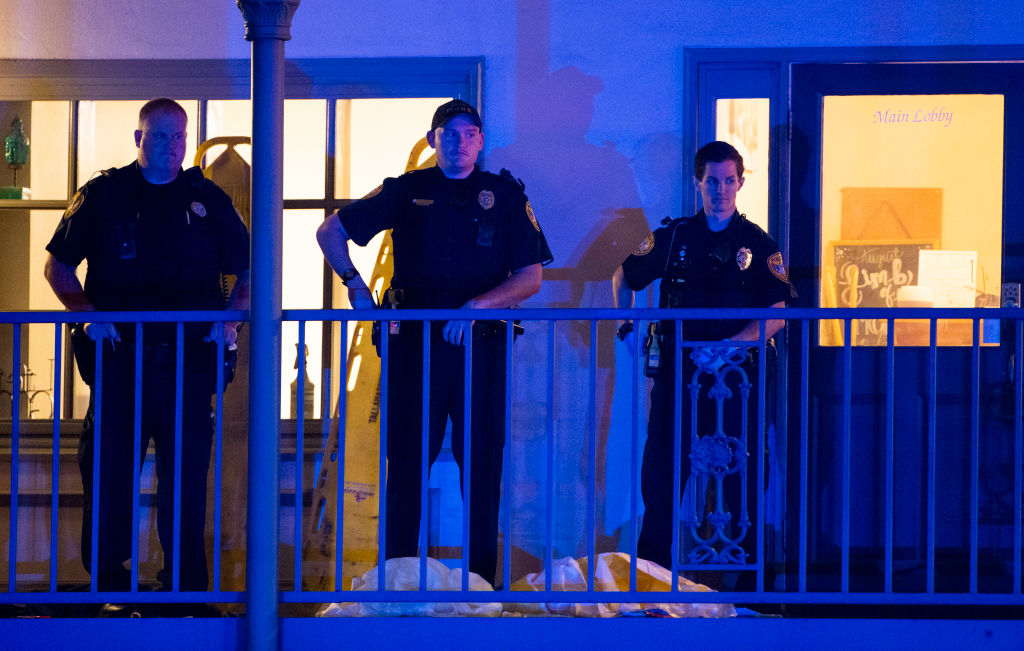 Tallahassee police officers are stationed outside the HotYoga Studio after a gunman killed one person and injured several others inside on November 2, 2018.