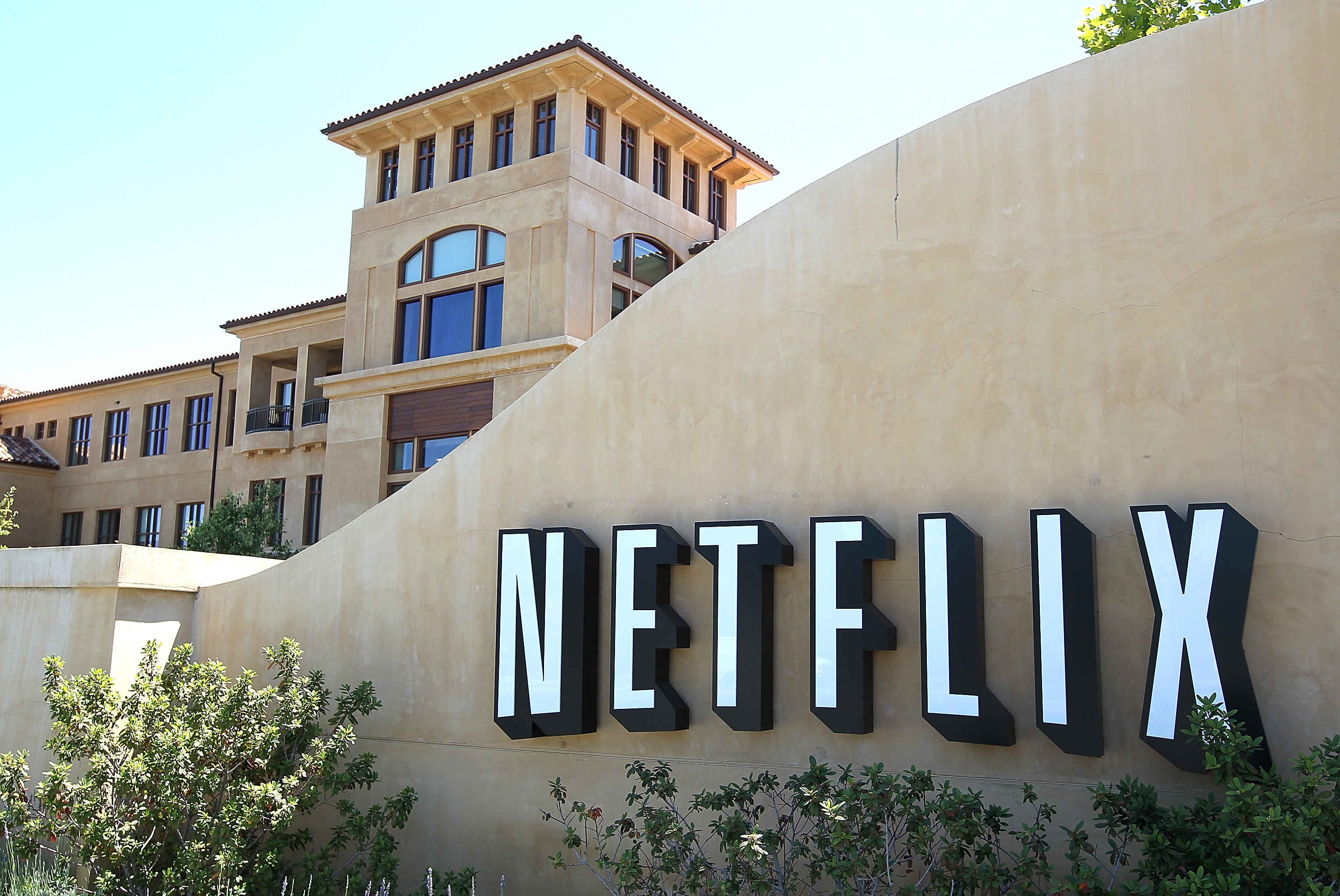 Netflix shares jump as new subscriber sign-ups beat expectations.