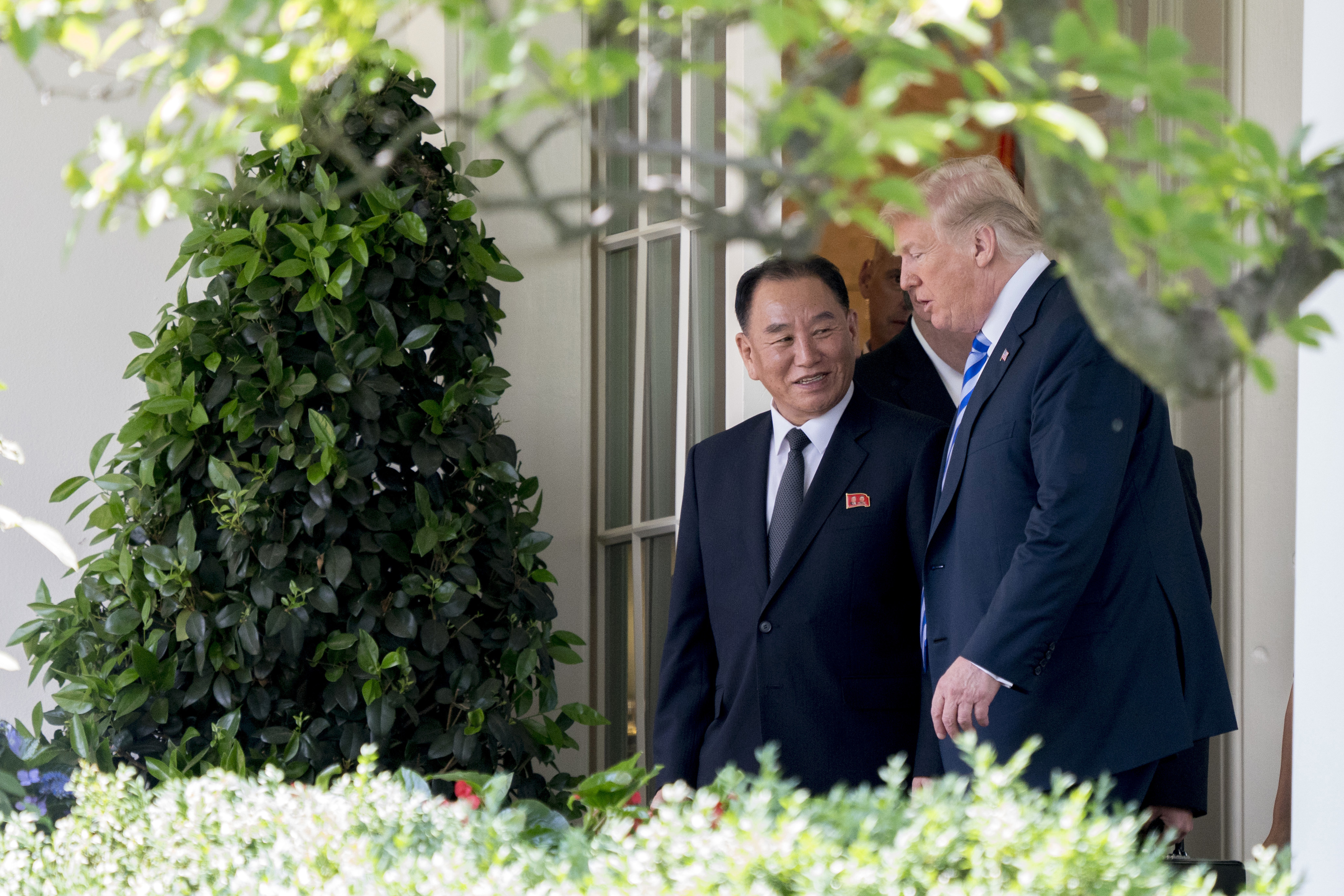 President Donald Trump talks with Kim Yong Chol, former North Korean military intelligence chief and one of leader Kim Jong Un&#039;s closest aides, as they walk from their meeting in the Oval Off