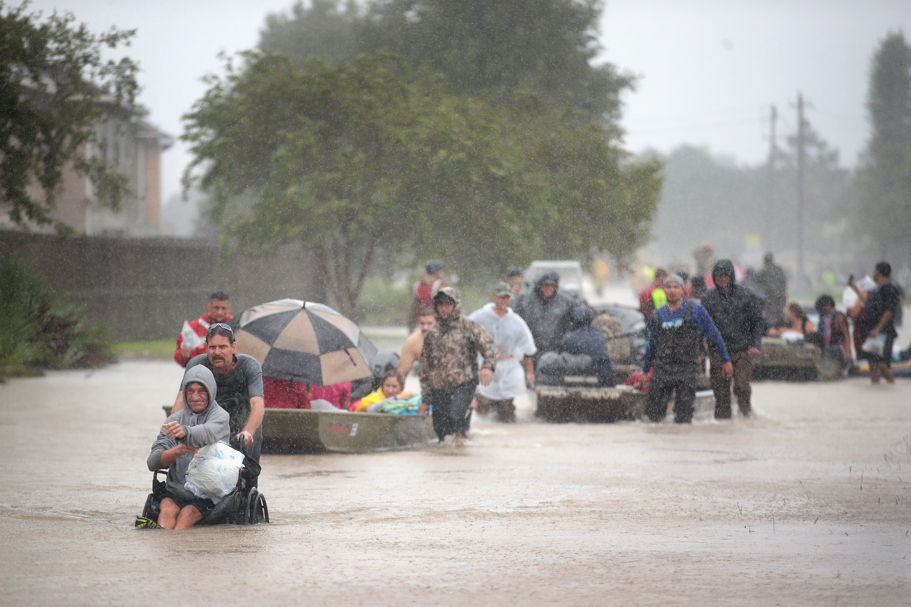 Houston residents wade in floodwaters