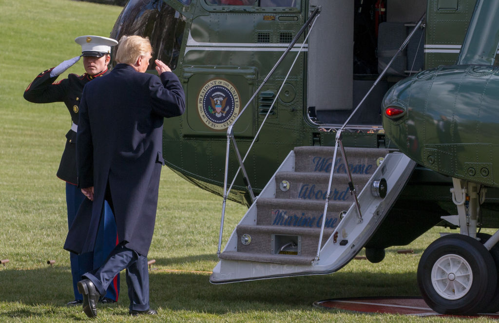 President Donald Trump walks from greeting visitors to the Marine One helicopter as he departs for Mar-A-Lago from the South Lawn of the White House on March 23, 2018 in Washington, DC. 