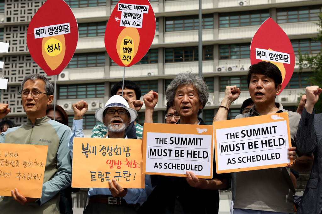 South Korean activists protest the cancellation of the Trump-Kim summit.
