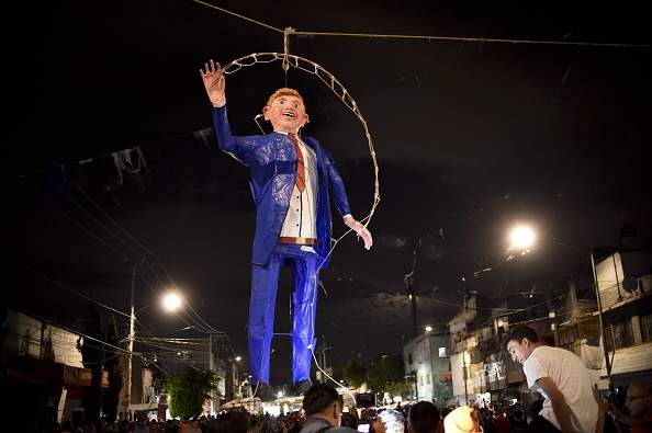 Mexicans burn a Donald Trump effigy during a Holy Week celebration