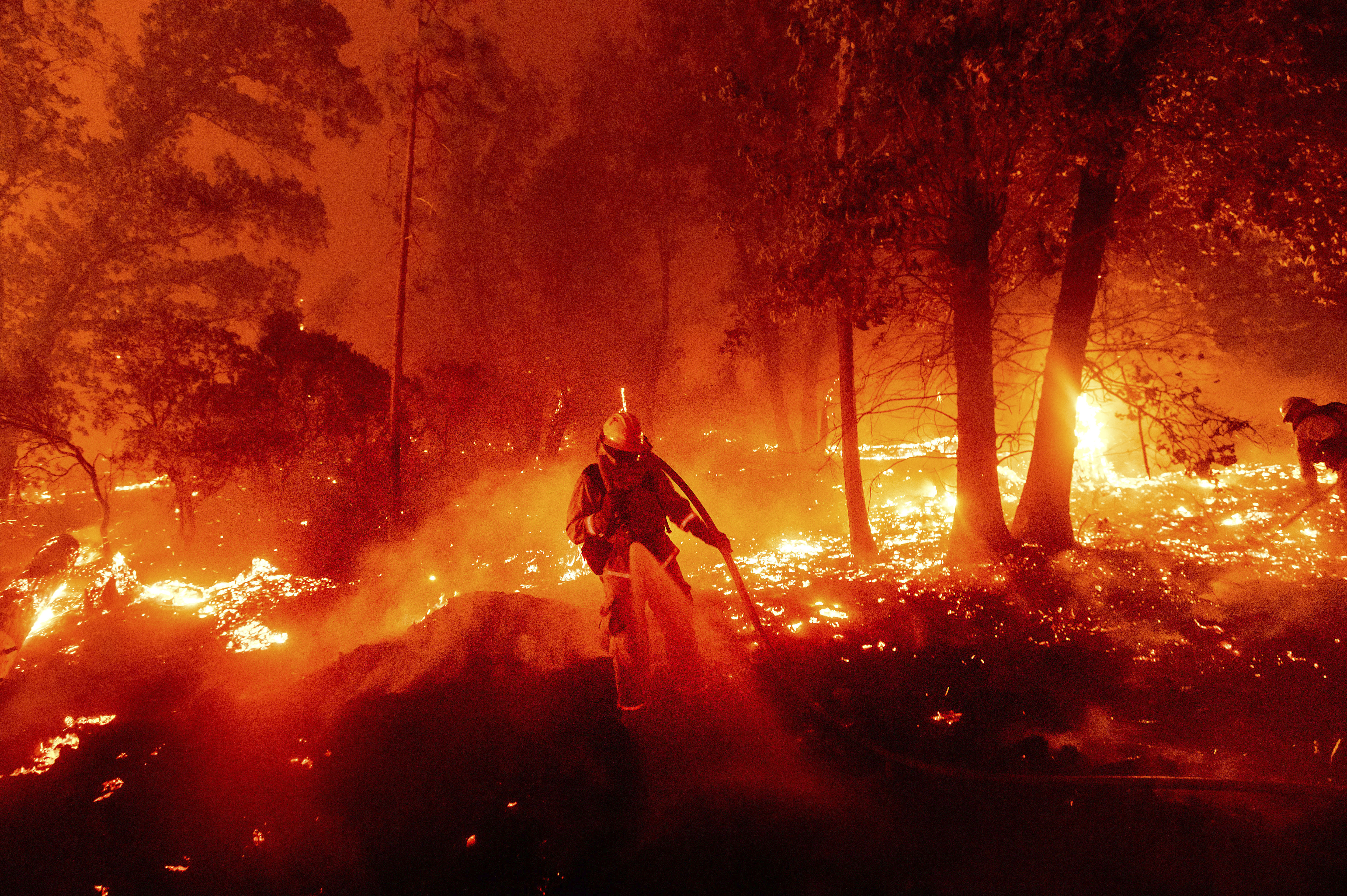 A California firefighter battles a blaze.