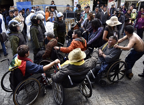 Disabled protesters clash with police in La Paz, Bolivia.