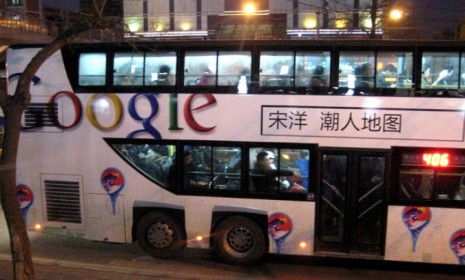 A Google advertisement is seen on a Beijing bus.