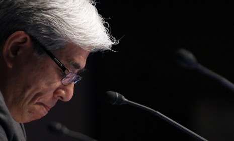 Sony CFO Masaru Kato looks down during his statement about the tech giant&#039;s largest annual loss since 1996.
