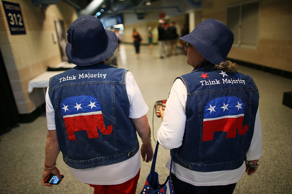 Two people in GOP logo jackets