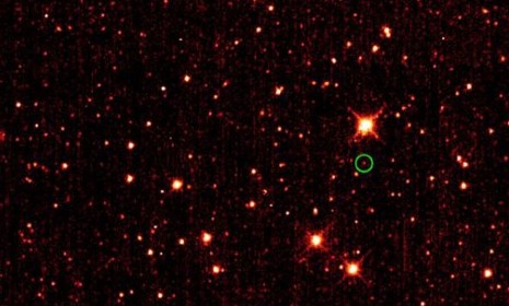An asteroid (circled in green) 