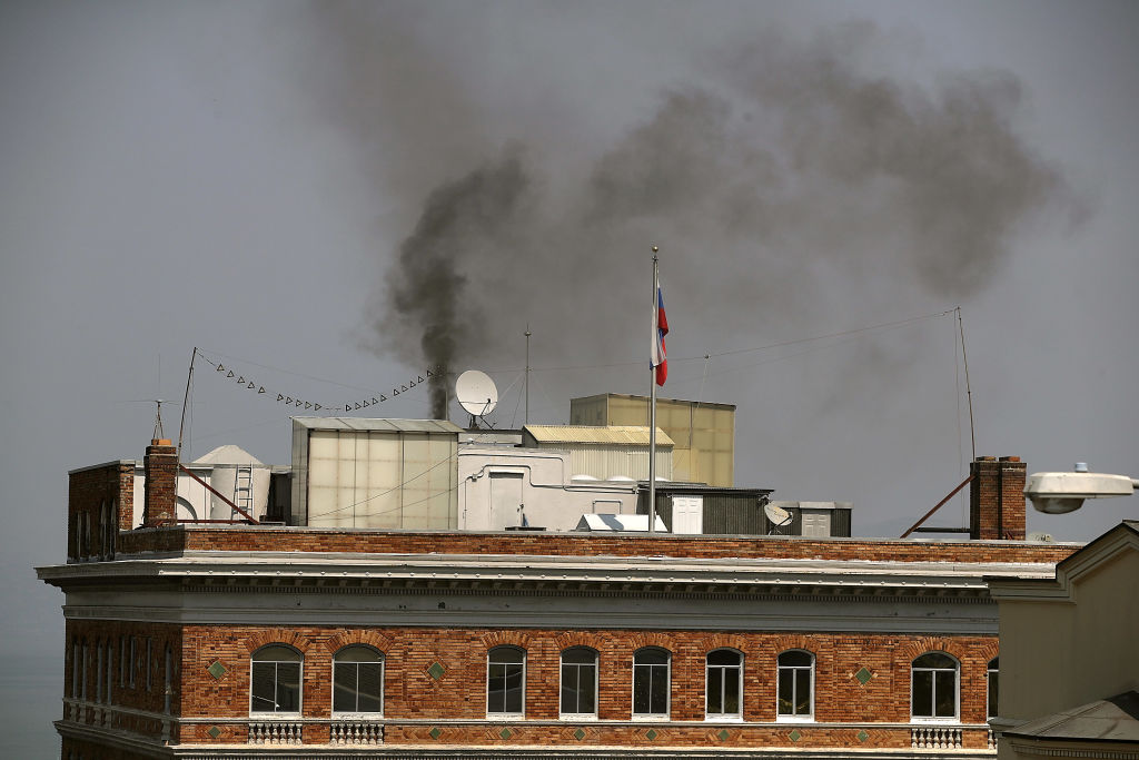 Black smoke billows from a chimney on top of the Russian consulate on September 1, 2017 in San Francisco, California