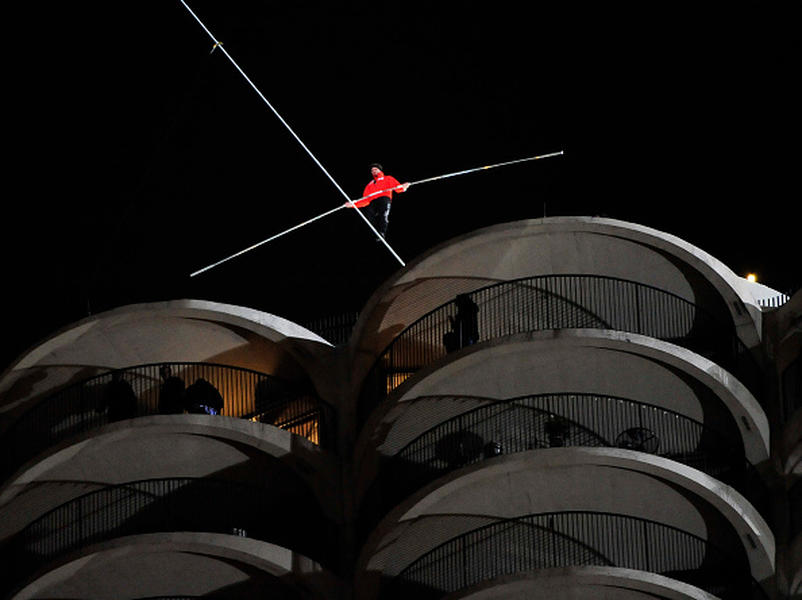 Chicago lets out a sigh of relief as daredevil successfully tightropes across buildings