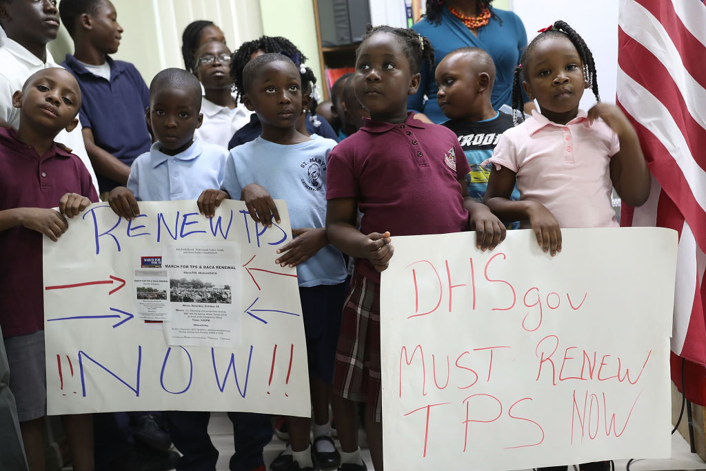 Children call on officials to renew TPS.