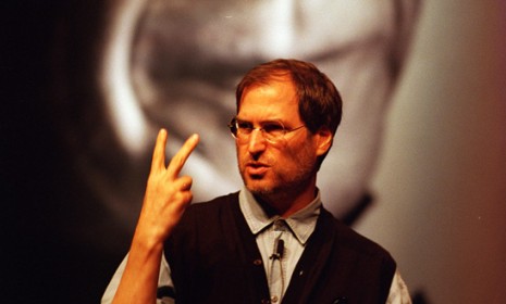 Steve Jobs, speaking at a publishing conference in 1997, stands in front of a giant poster of Pablo Picasso, featured in Apple&#039;s landmark &quot;Think Different&quot; campaign.