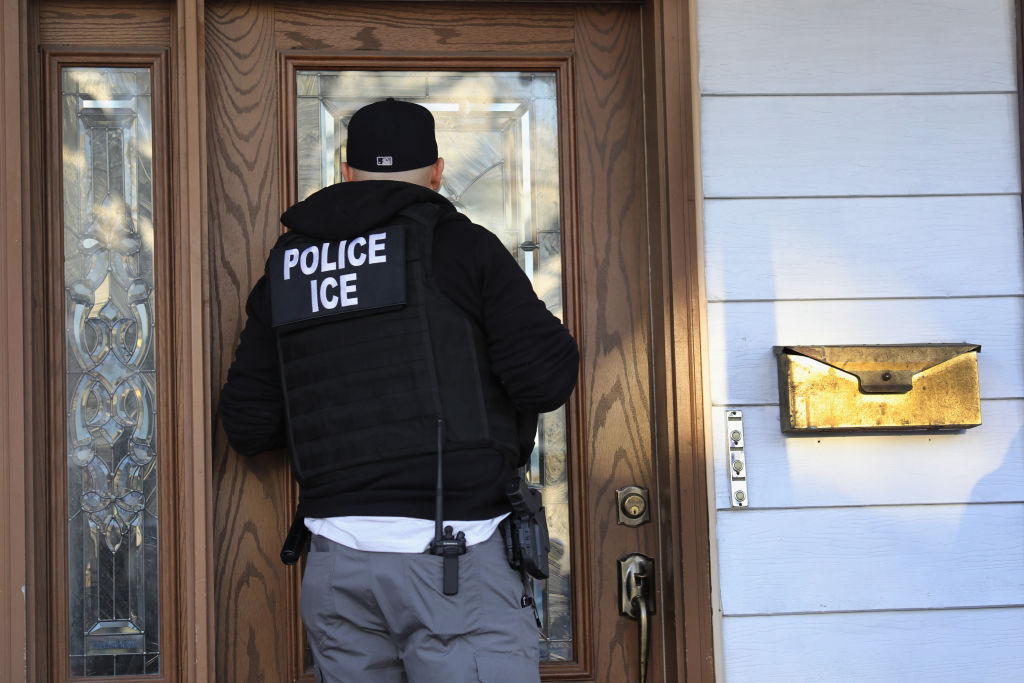 ICE agent at house of undocumented immigrant. 