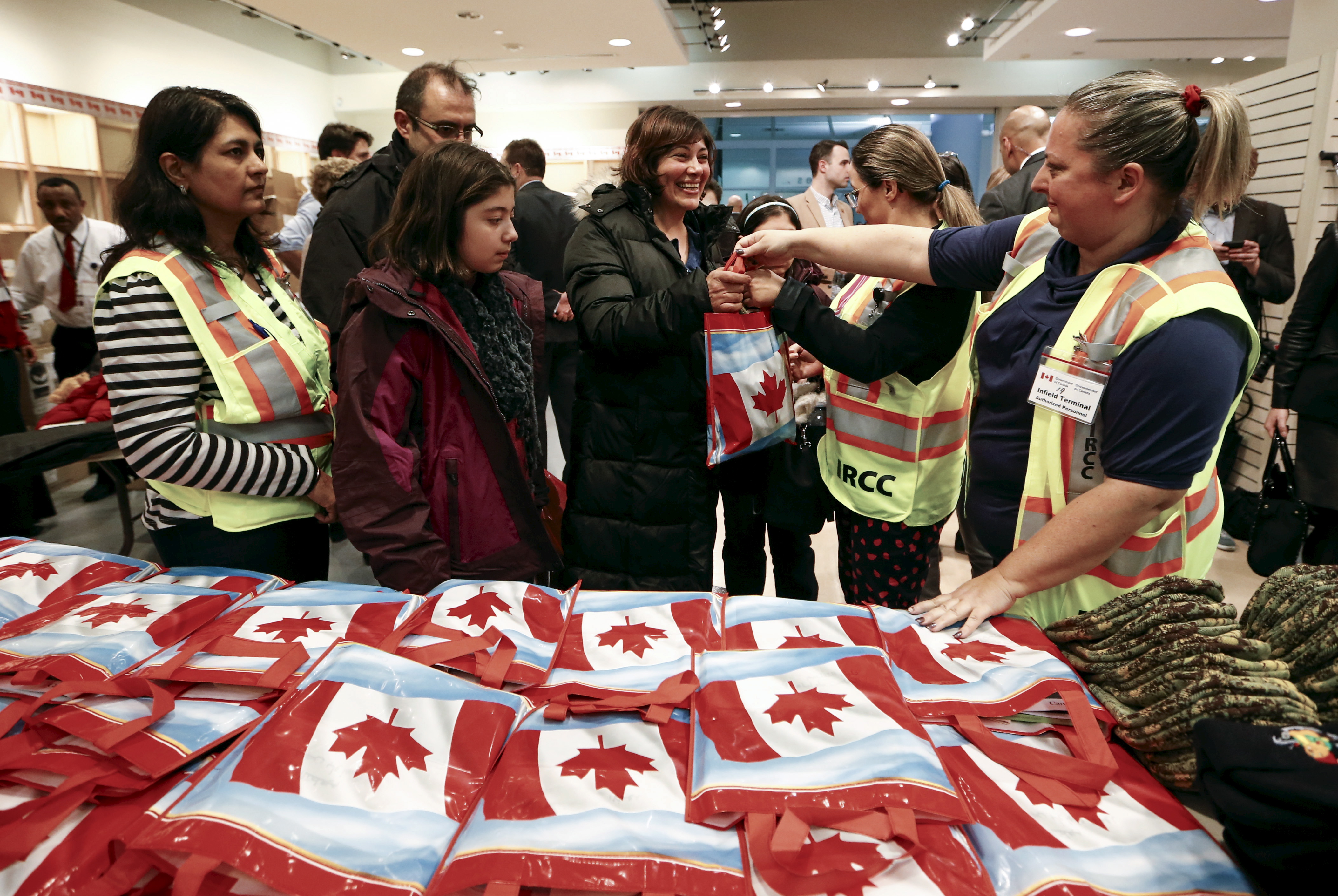 Syrian refugees receive Canada welcome bags.