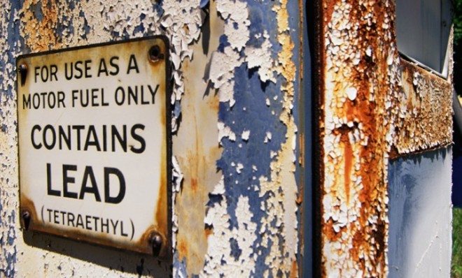 A crumbling lead contamination warning sign. 