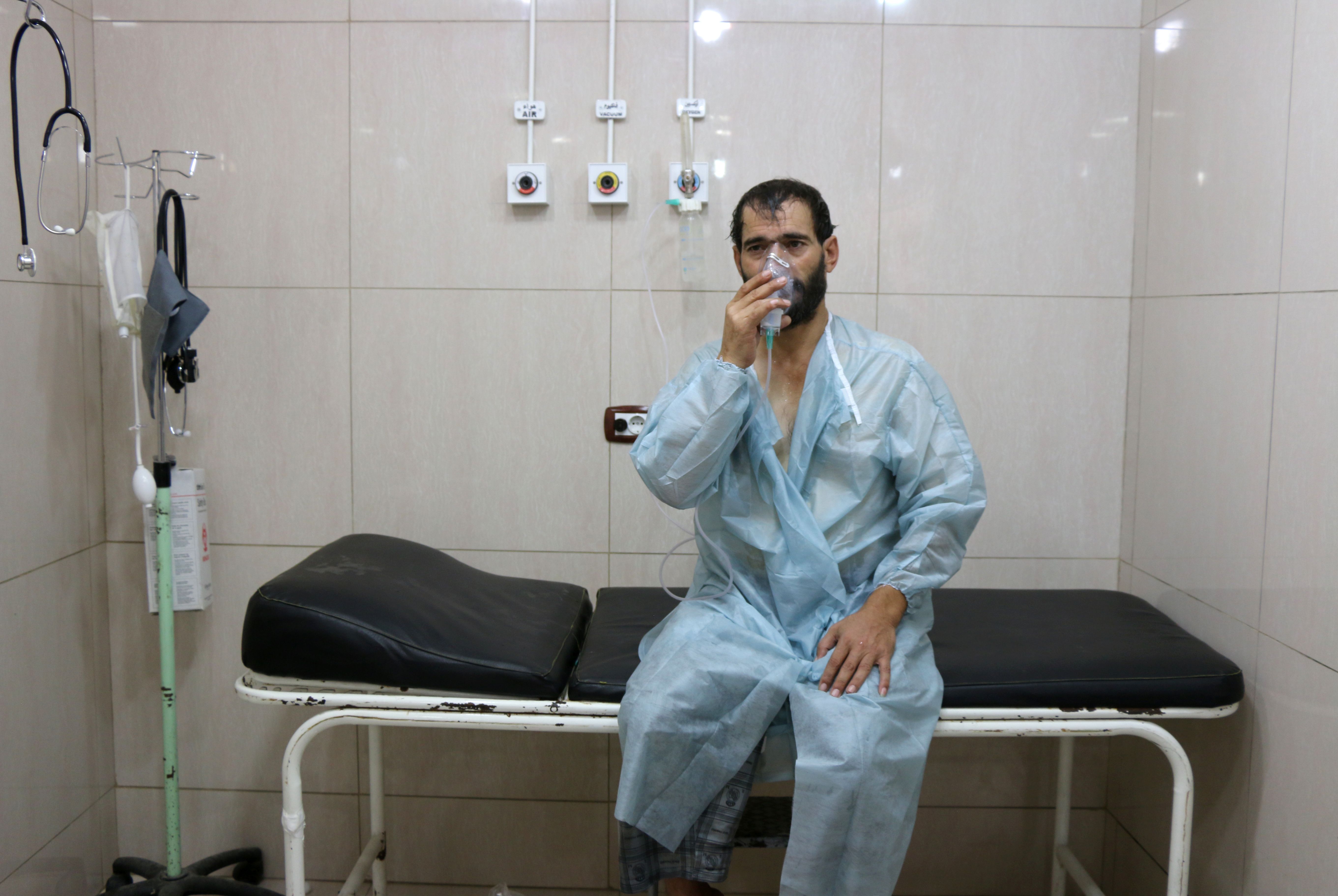 A Syrian man takes oxygen to ease his breathing problems