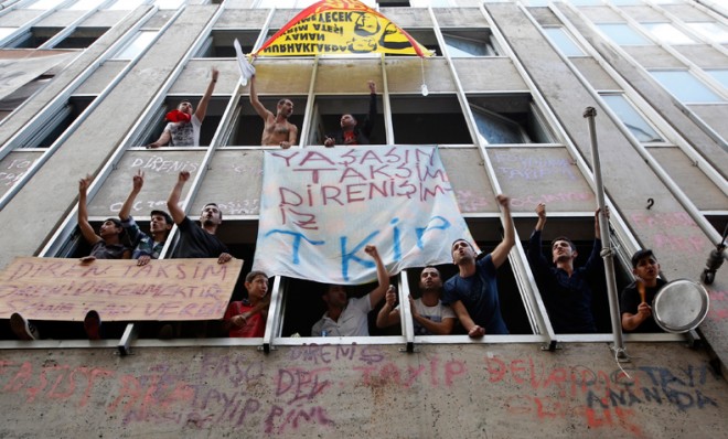 Demonstrators shout slogans from the windows of a building during a protest against Prime Minister Tayyip Erdogan in central Istanbul, June 2.