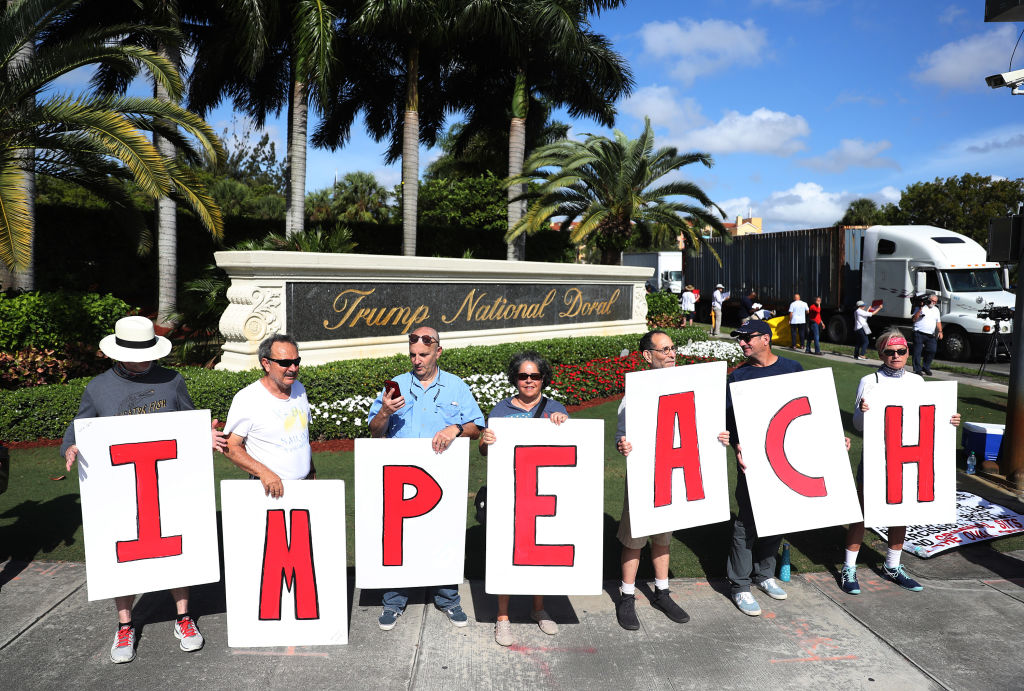 Pro-impeachment demonstrators outside a Trump golf course in Florida.