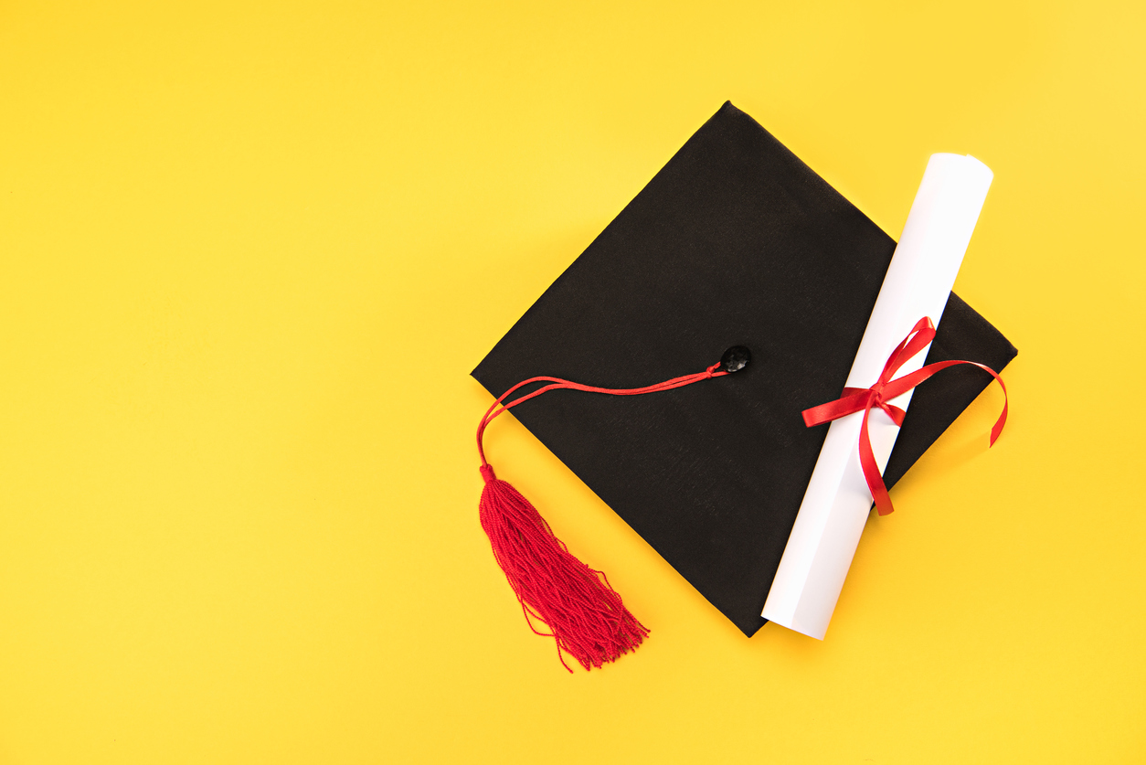 A graduation cap and diploma.