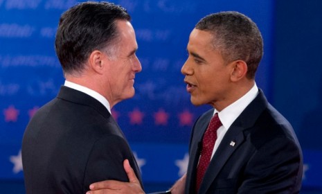 Mitt Romney and President Obama greet each other before the second debate on Oct. 16: The candidates remain neck-and-neck ahead of the election.
