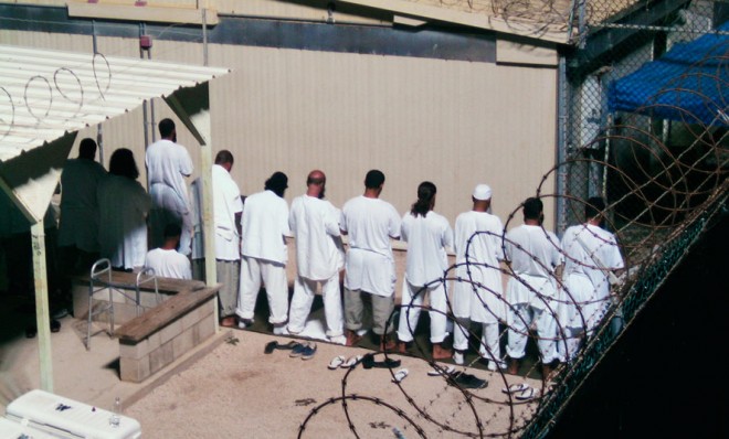 Detainees participate in early morning prayer sessions at Camp IV in Guantanamo Bay in 2009.